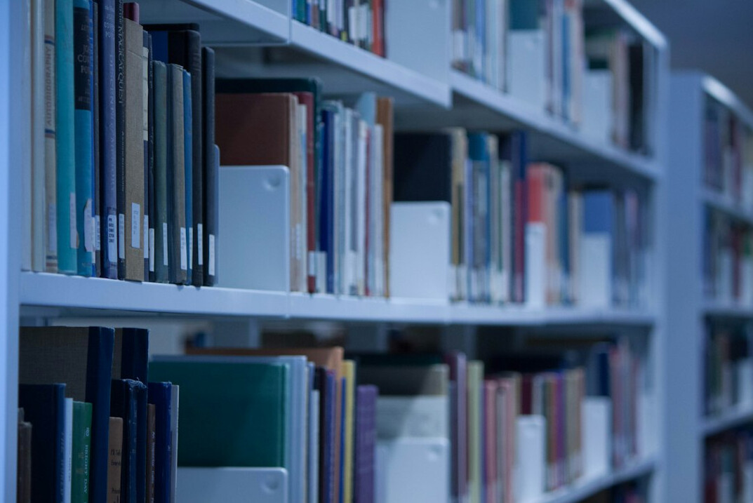 Rows of archival document folders on a shelf